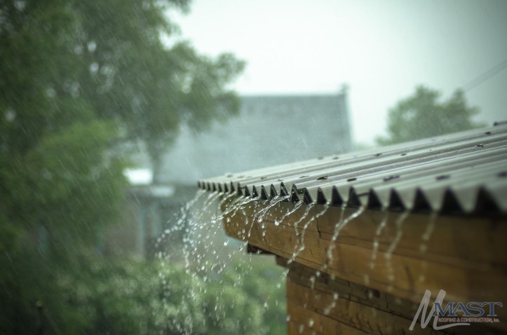 65459917 - rain flows down from a roof down